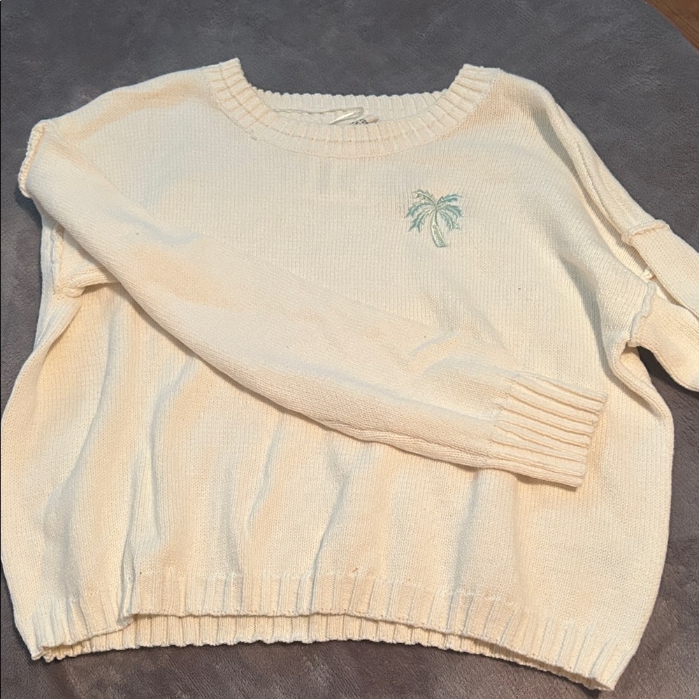 Elegant Cream Sweater with Embroidered Palm Detail